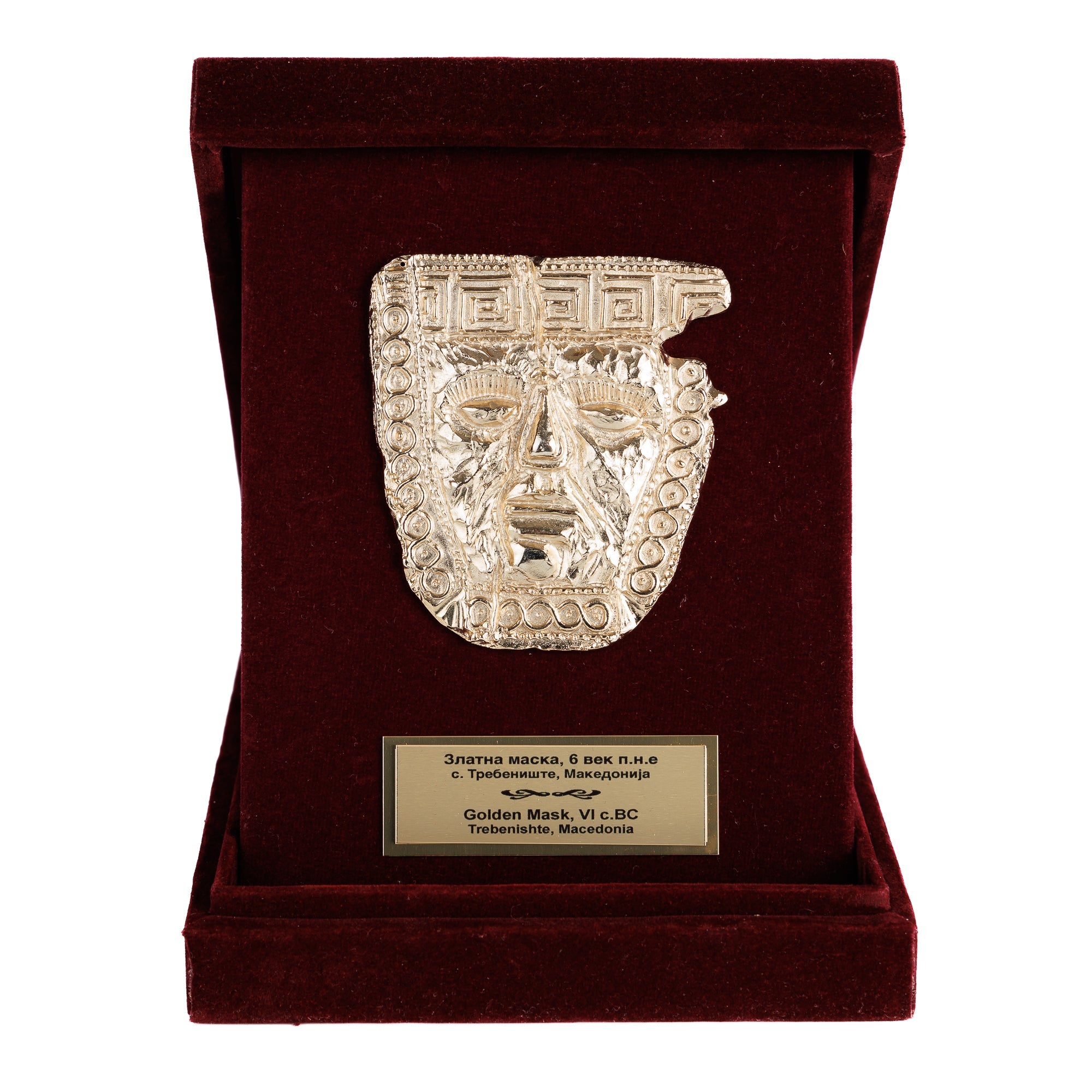 Преден приказ на отворената дипла која ја истакнува позлатената маска, совршен сувенир што сведочи за богатството на македонската археологија.